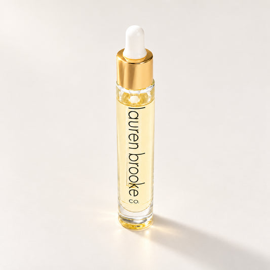 Lauren Brooke Deep Pore Spot Treatment in a clear dropper bottle with a gold collar