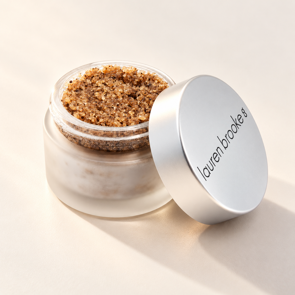 Lauren Brooke Organic Rejuvenating Coffee Scrub in an open frosted jar with a silver lid