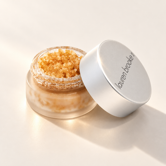 Lauren Brooke Organic Sweet Chai Lip Scrub in an open frosted jar with its lid beside it