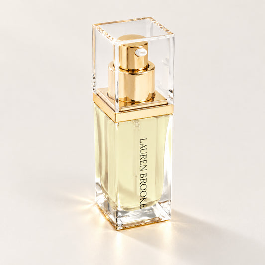 Lauren Brooke Organically Clear Serum in a rectangular clear bottle with a gold pump
