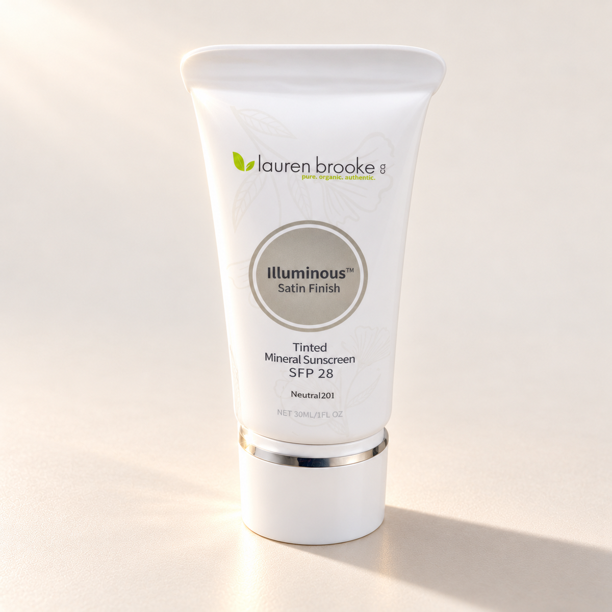 Lauren Brooke Tinted Mineral Sunscreen in a white tube with a silver band and white cap