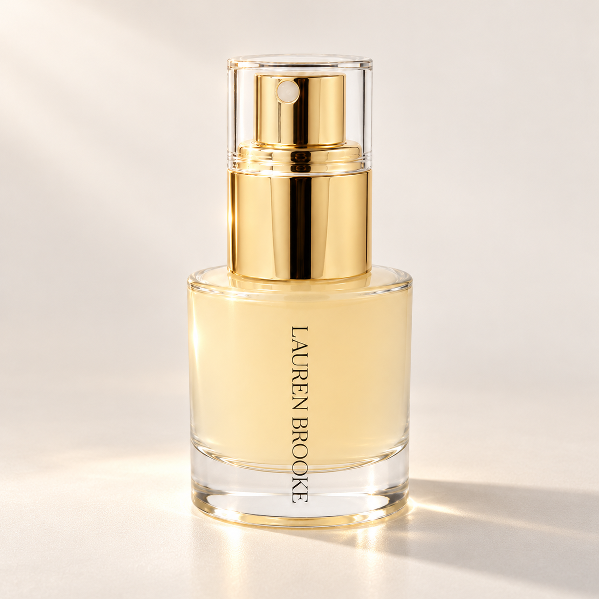 Lauren Brooke Organic 3-in-1 Hydration & Makeup Mist in a clear bottle with a gold spray pump