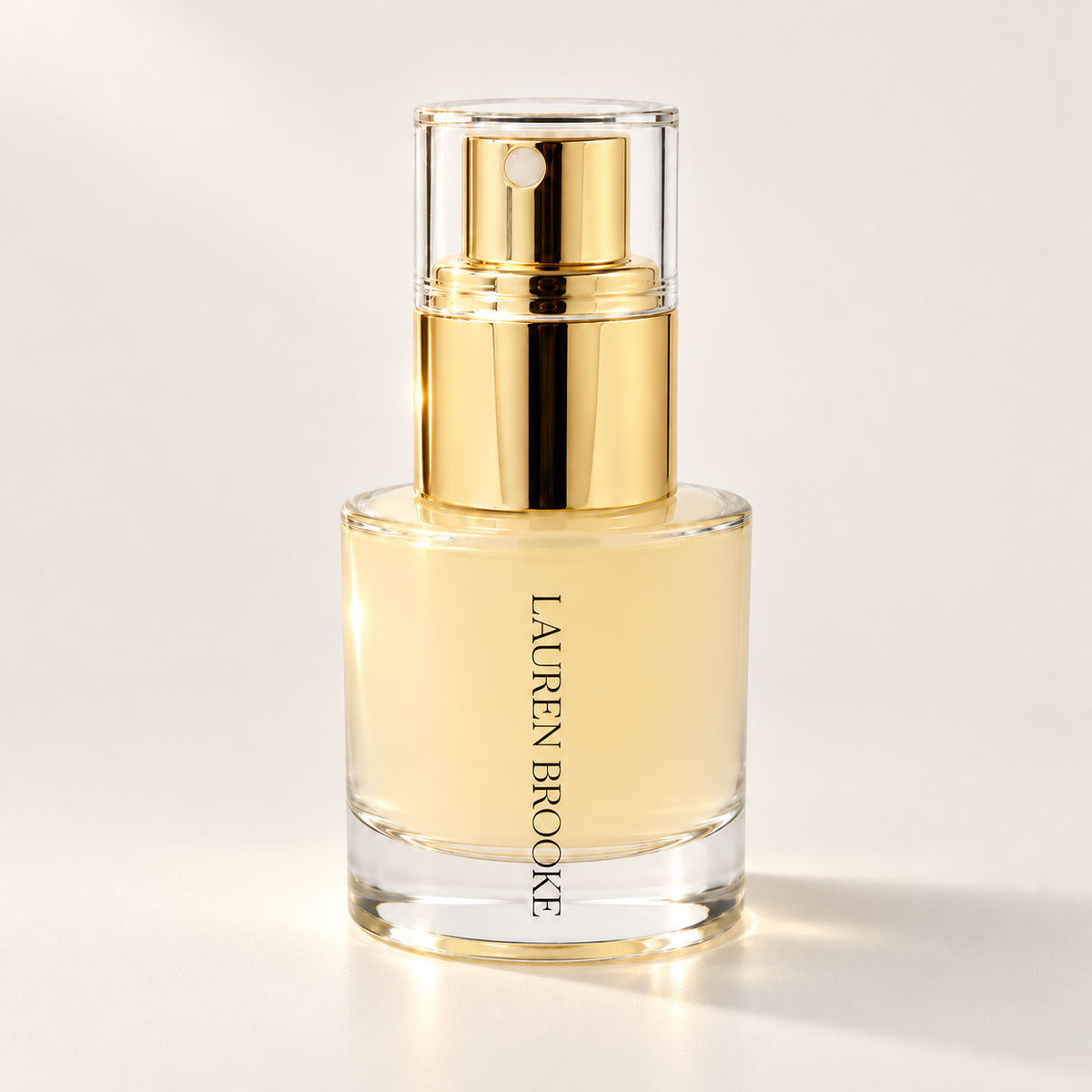 Lauren Brooke Organic 3-in-1 Hydration & Makeup Mist in a clear bottle with a gold spray pump