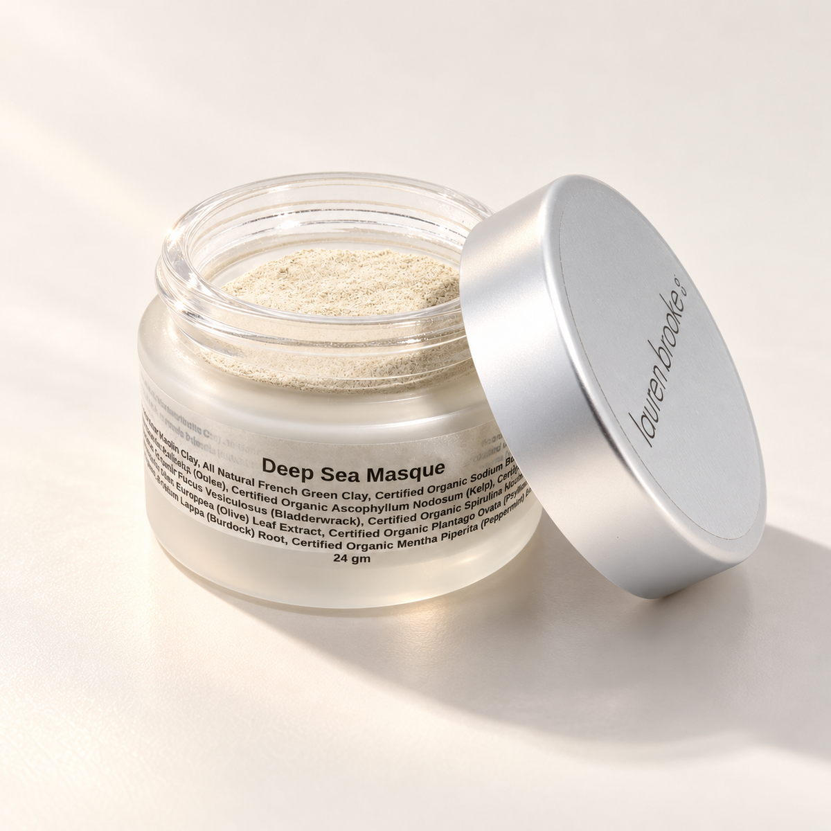 Lauren Brooke Deep Sea Masque facial mask powder in an open frosted jar with a silver lid