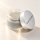 Lauren Brooke French Clay & Charcoal Masque powder in an open frosted jar with a silver lid