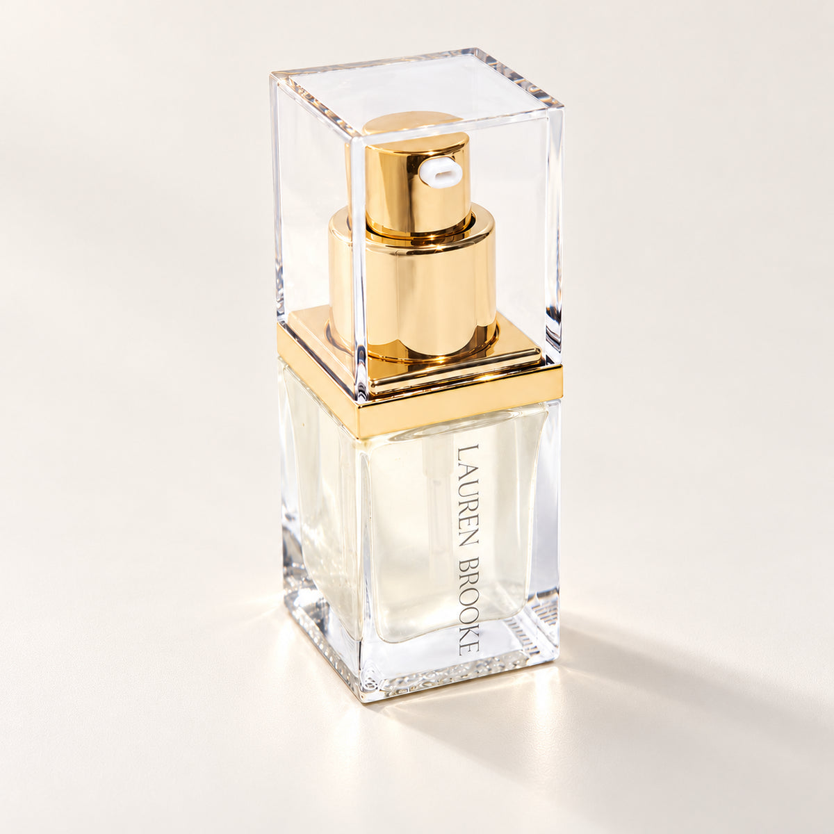 Lauren Brooke Intensive Immortal Elixir in a clear rectangular bottle with a gold pump