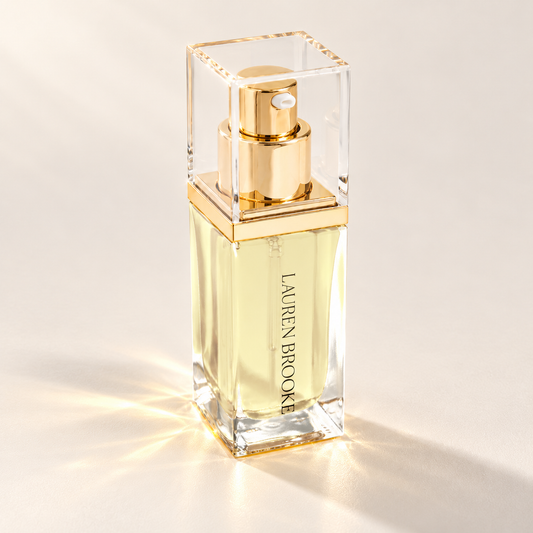Lauren Brooke Organically Clear Serum in a rectangular clear bottle with a gold pump