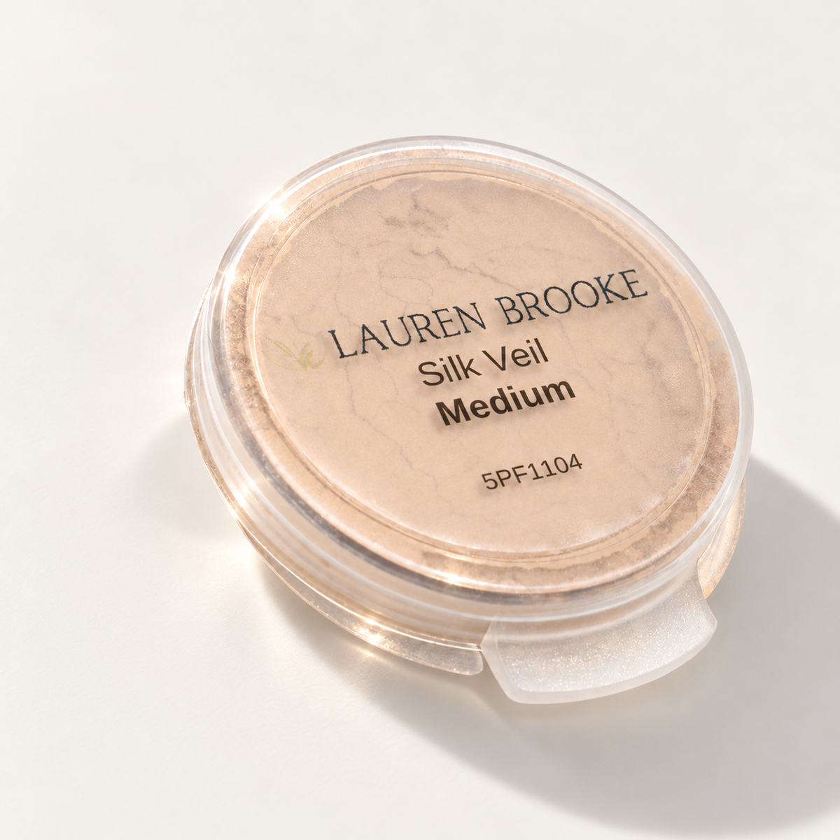 Lauren Brooke Silk Veil Medium powder sample in a clear flip-top container