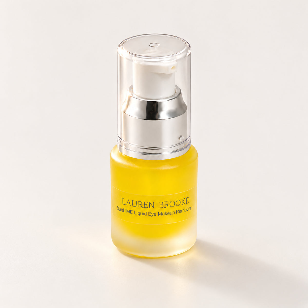Lauren Brooke SubLIME Liquid Eye Makeup Remover in a frosted bottle with a silver and white pump