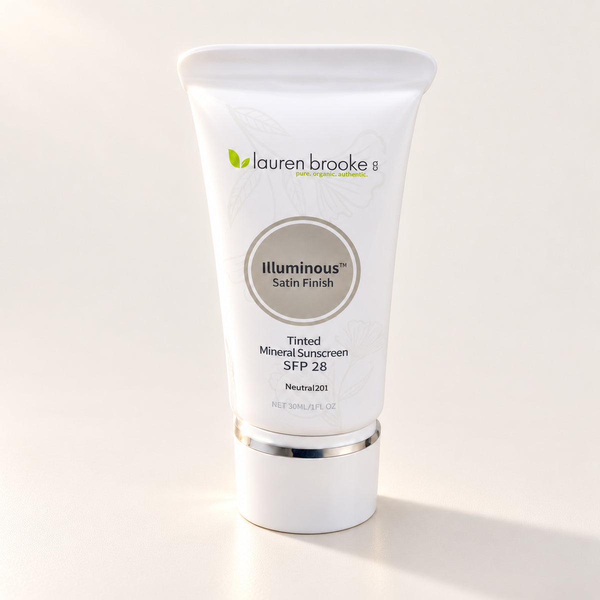 Lauren Brooke Tinted Mineral Sunscreen in a white tube with a silver band and white cap